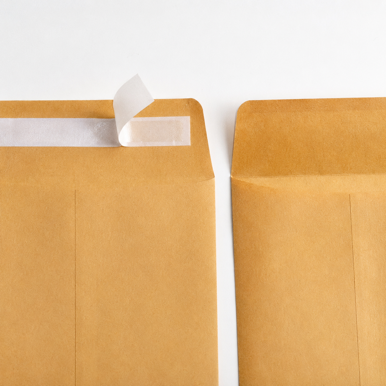 Business mailing envelopes with traditional gummed flap sealing